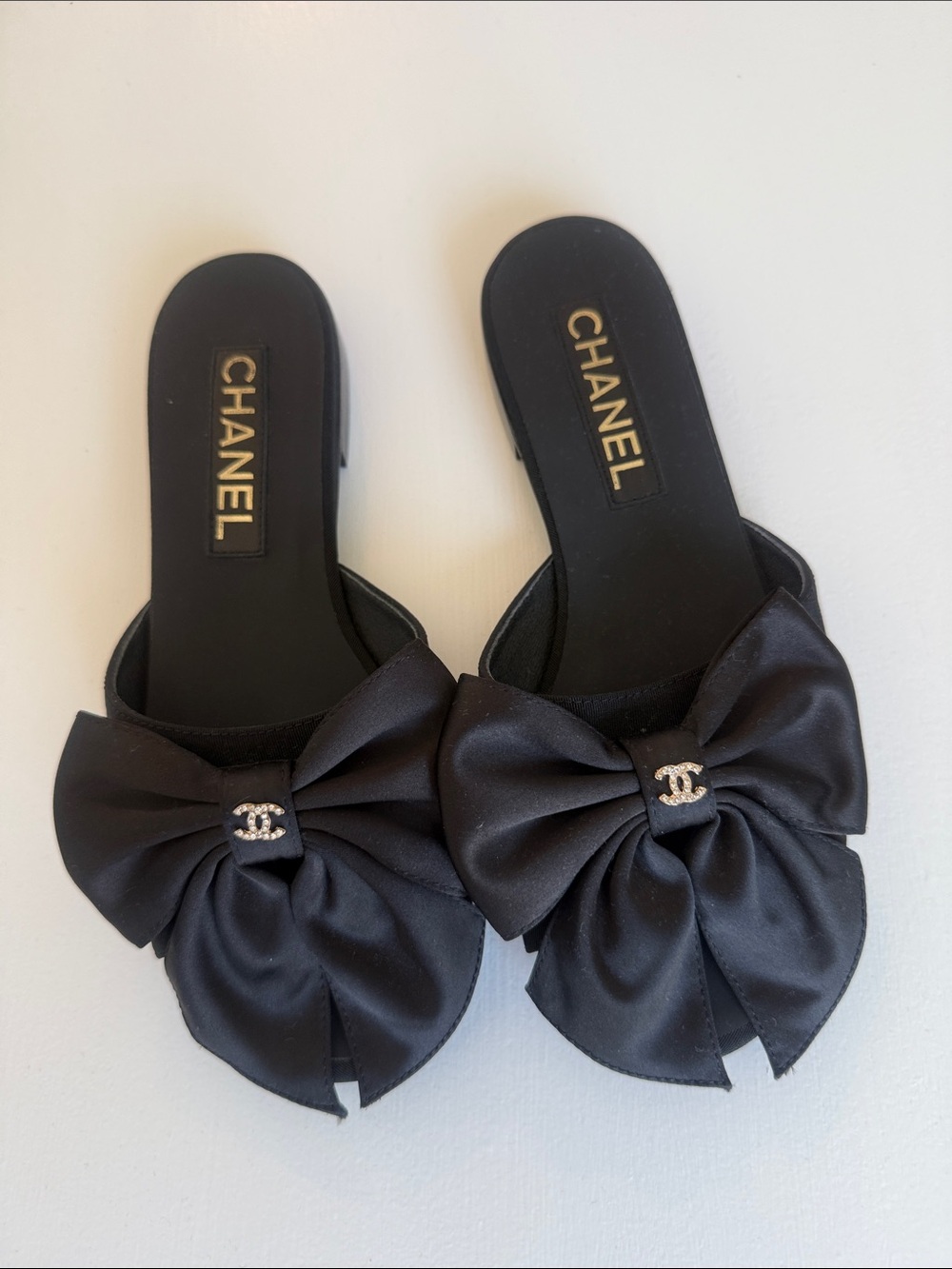 CHANEL Black Satin Bow Slide Mules with CC Accent